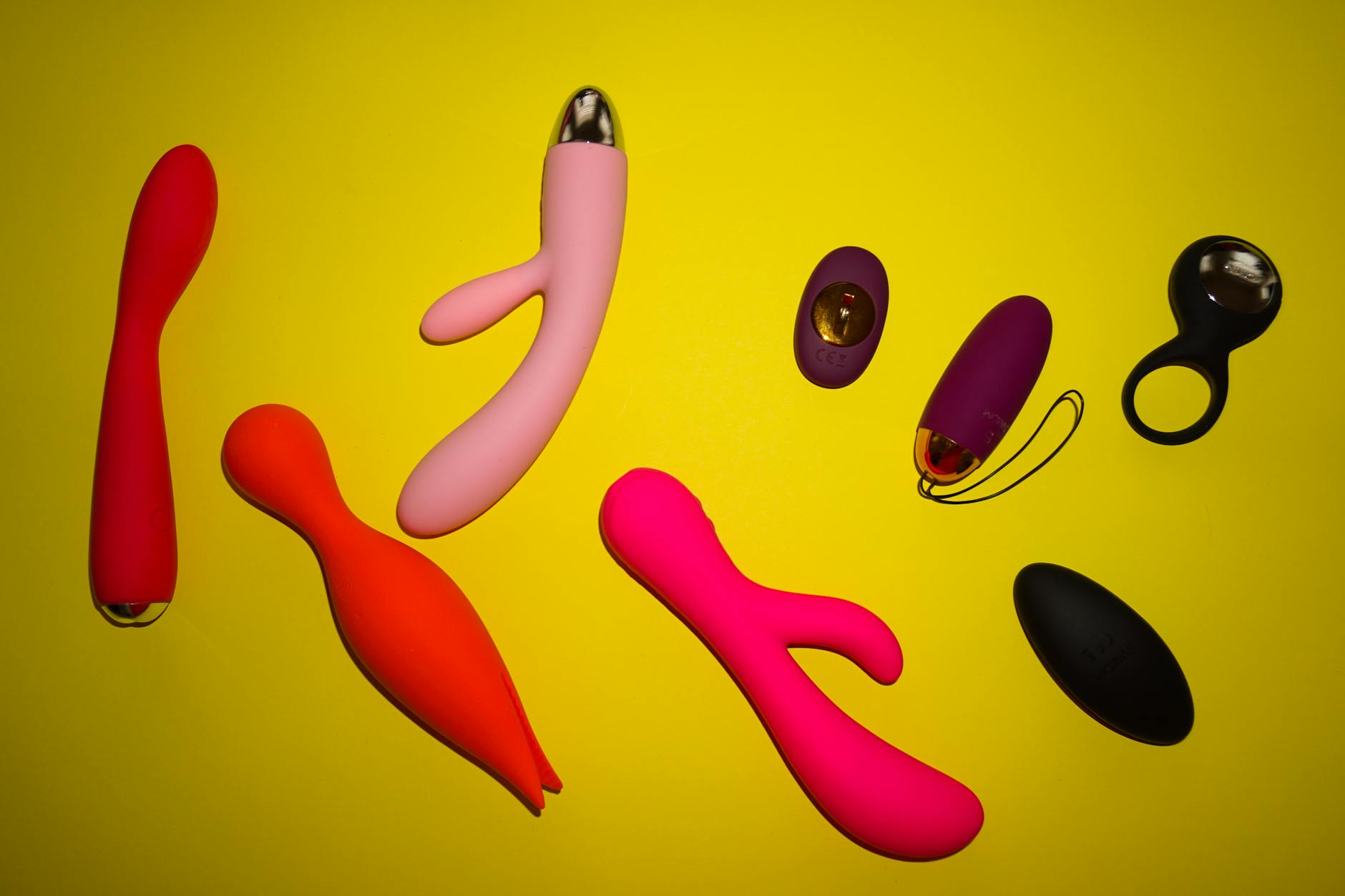 A blue silicone vibrator held in hand against a solid background, symbolizing reclaiming pleasure